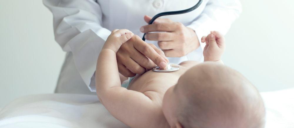 "Pediatrician using stethoscope to examine baby at Infinity Heart Hospital Jabalpur"