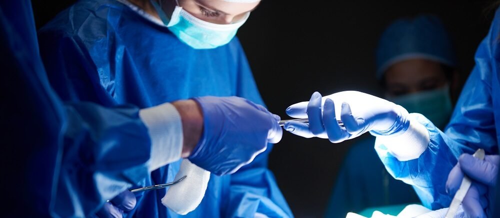"Doctors performing surgery in sterile operation theatre at Infinity Heart Hospital Jabalpur"