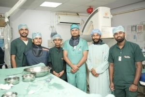 "Team of doctors and nurses in operating room at Infinity Heart Hospital Jabalpur"